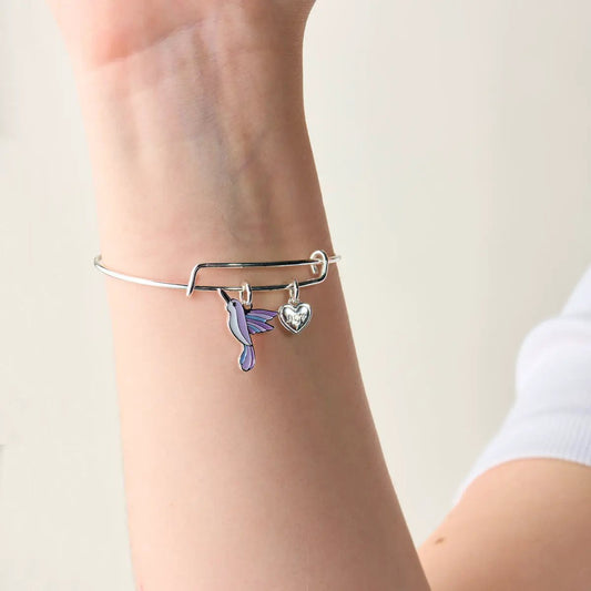 Joy hummingbird bracelet; silver-tone bangle with purple hummingbird charm and Joy heart charm on Tampa Home & Garden Store
