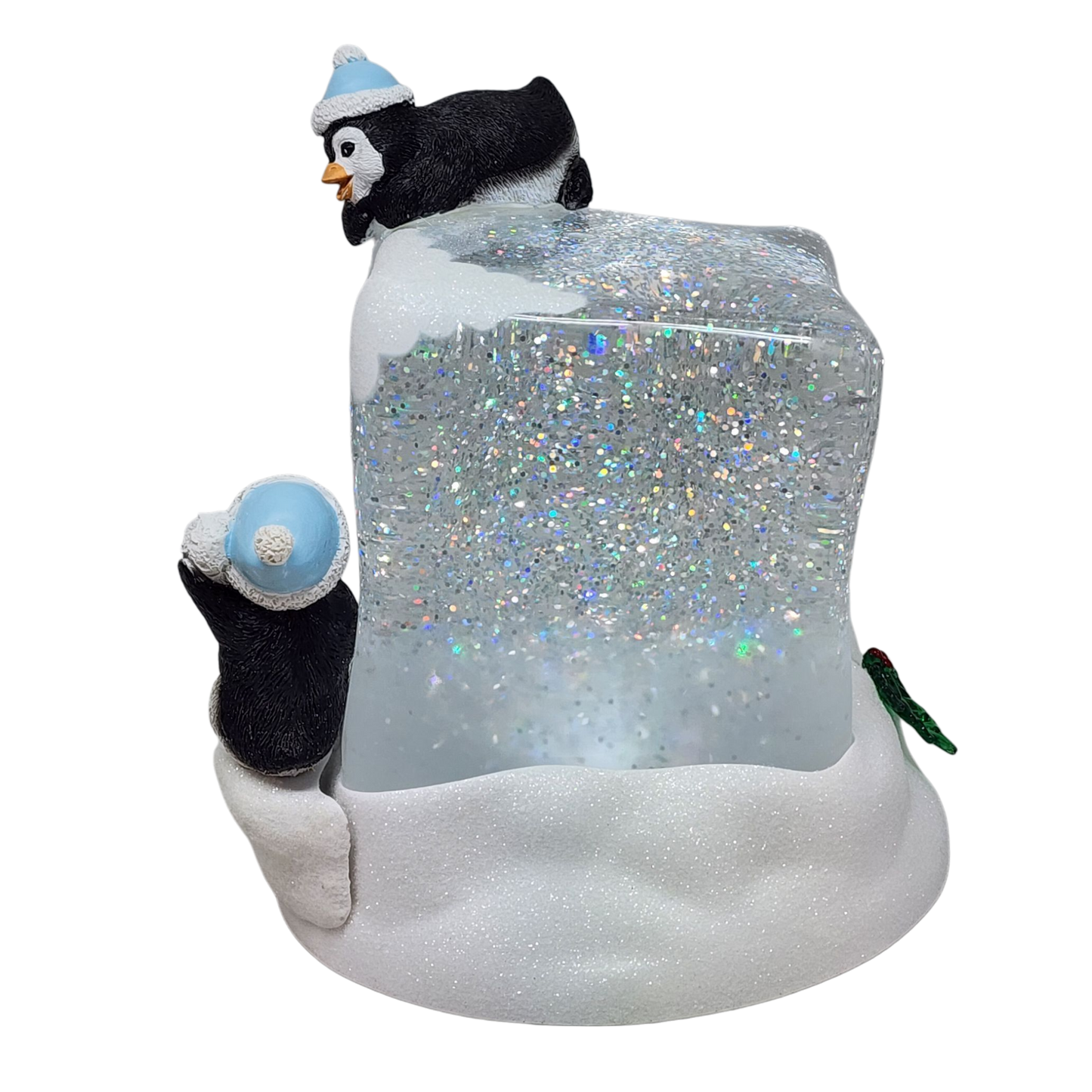 Lighted swirl snowglobe cube with penguin wearing blue hat atop glittery base on Tampa Home & Garden Store