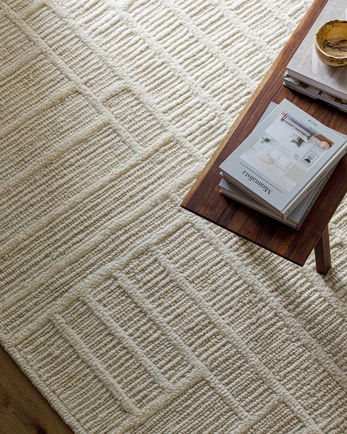 Kelburn Area Rug by Boutique Rugs in creamy ivory with textured loop pile on wooden floor on Tampa Home & Garden Store