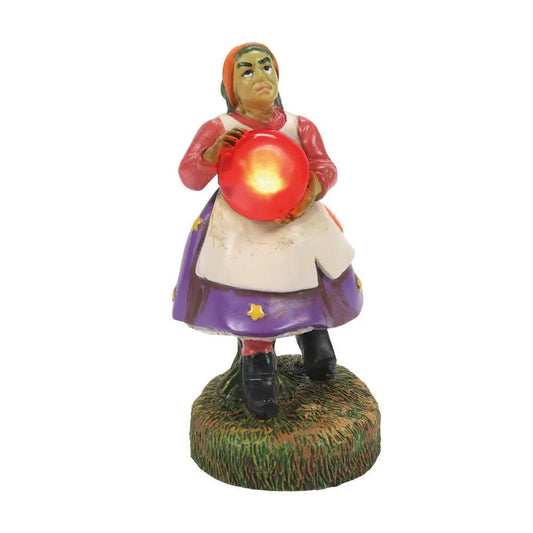 Cryptic Cave Mystic ceramic figurine holding a glowing red orb with purple skirt on grassy base on Tampa Home & Garden Store