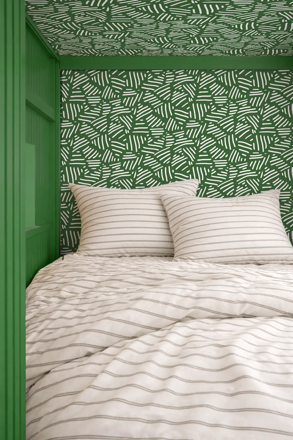 Wallpaper Simple Stripes Green Tone with white striped pattern on green wall and white bedding on Tampa Home & Garden Store