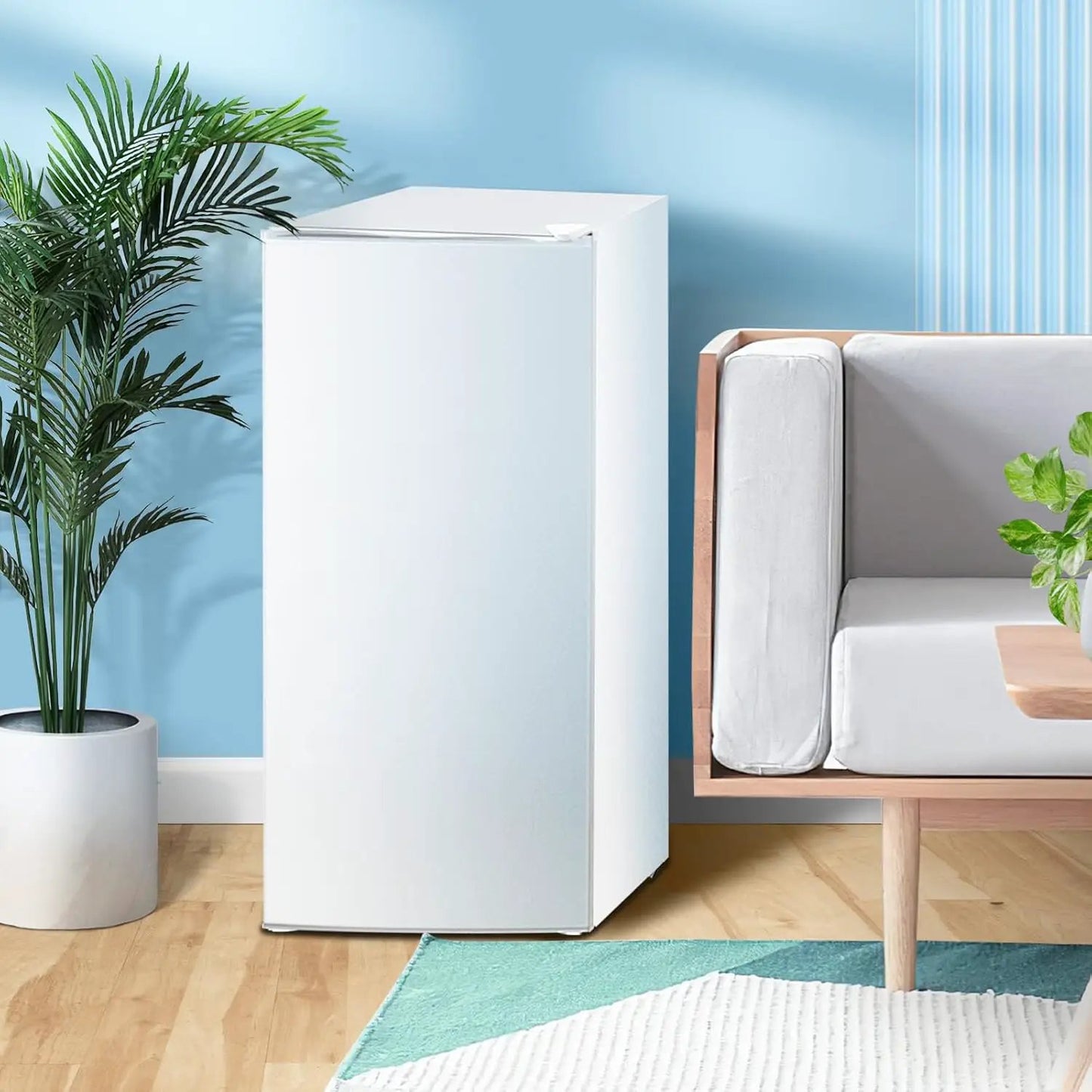 Kismile upright freezer 6.0 cu ft white beside a modern sofa in a bright blue room on Tampa Home & Garden Store