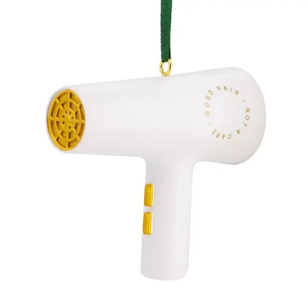 Hairdryer-shaped Christmas ornament in white with yellow nozzle and buttons, green ribbon hanger on Tampa Home & Garden Store