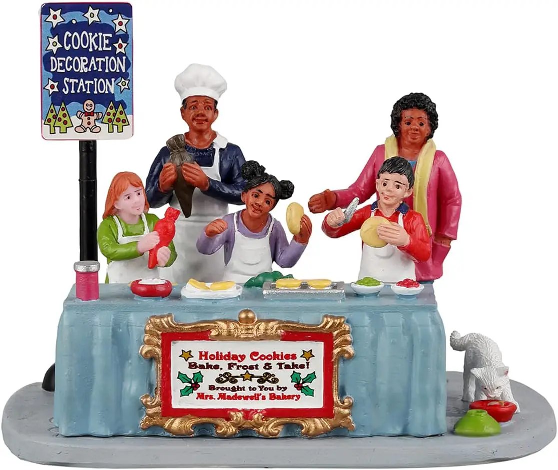 Cookie Decorating Station festive village set with bakers around a blue table and plaque on Tampa Home & Garden Store