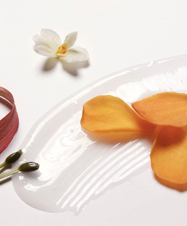 LABO-H Shampoo swatch on white plate with orchid and orange petals Blanche&Woody on Tampa Home & Garden Store