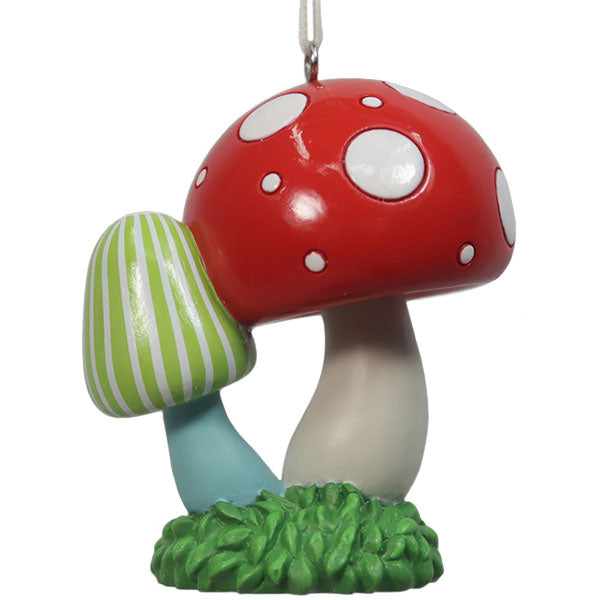Red mushroom ornament with white polka dots, plus a green striped mushroom on a grassy base on Tampa Home & Garden Store