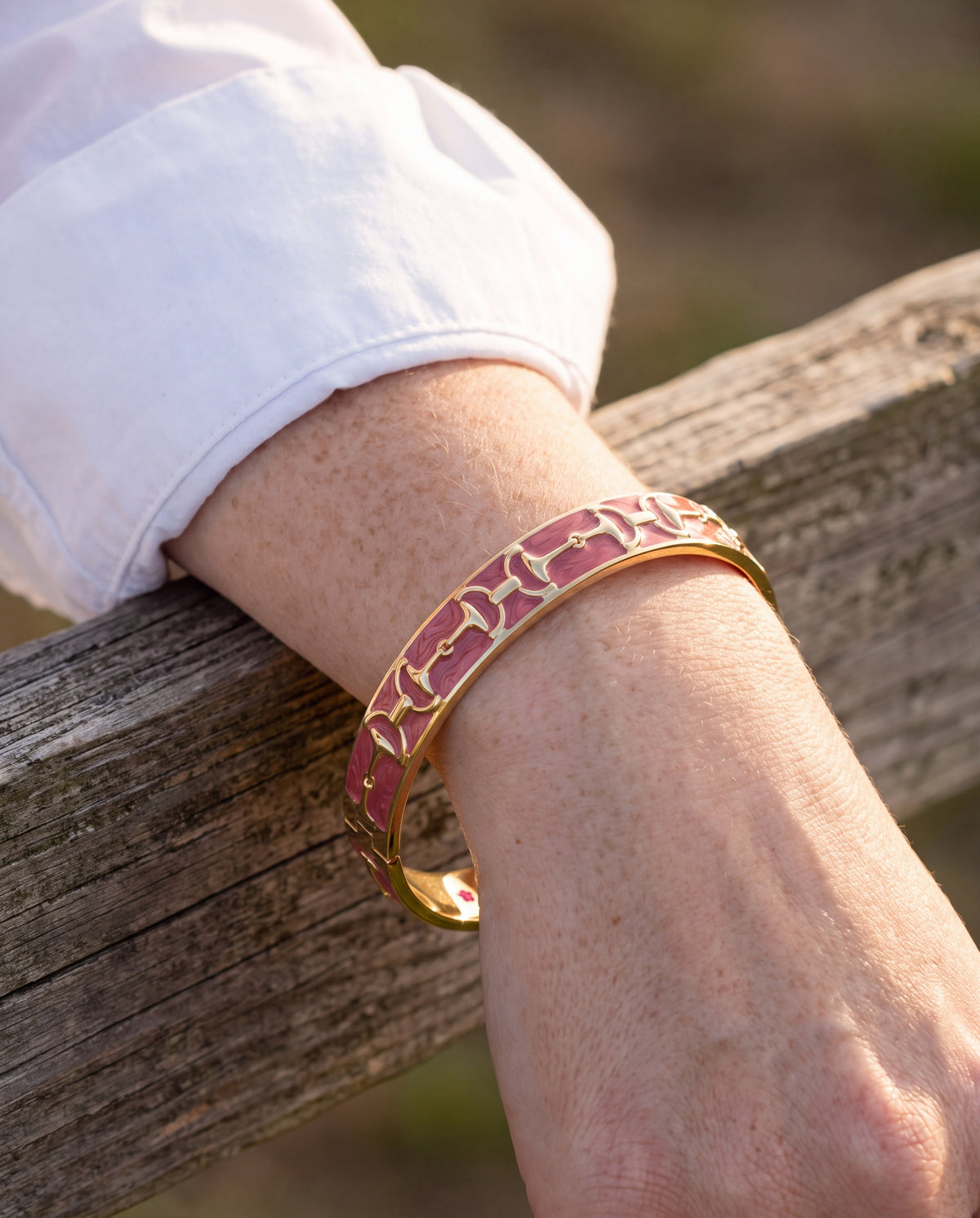 Equestrian Stirrup Bangle Raspberry by Lauren G Adams, raspberry with gold-tone hinges on Tampa Home & Garden Store