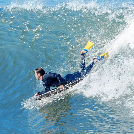 Gray DirectDeals lightweight bodyboard gliding on blue waves with a wetsuit clad rider on Tampa Home & Garden Store