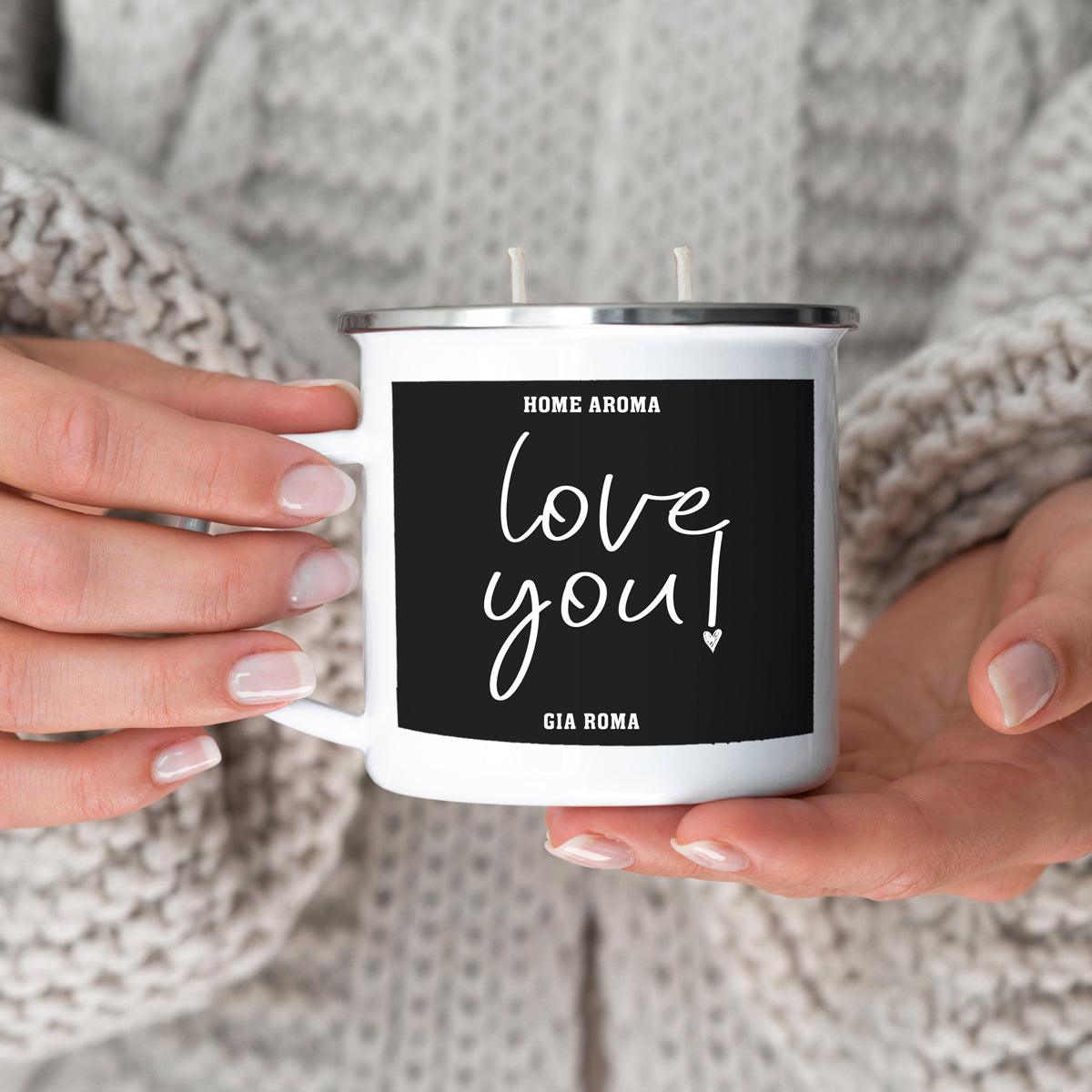 16oz Candle Mug Gia Roma white enamel mug with black label love you held by hands in a sweater on Tampa Home & Garden Store