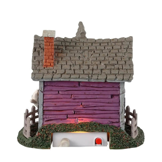 Ghost cottage Halloween village house with purple siding, gray roof and eerie lights on Tampa Home & Garden Store