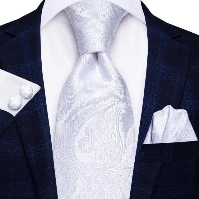 Silk necktie with white paisley print and matching pocket square on navy suit Stevvex on Tampa Home & Garden Store