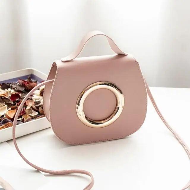 Stevvex pink PU leather crossbody bag with gold-tone circular ring accent, top handle on Tampa Home & Garden Store