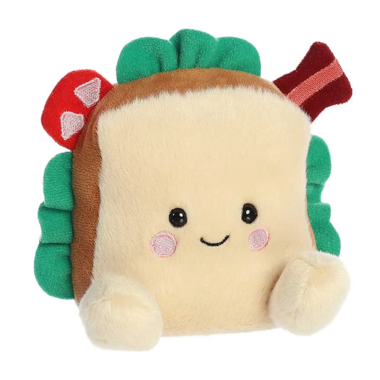 Tomás BLT Palm Pal Honest Straight Talk plush with beige face, green leaves, red trim on Tampa Home & Garden Store