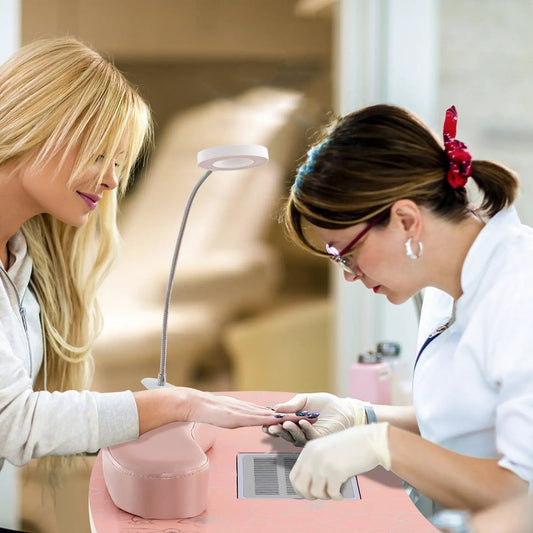Manicure nail table pink with bendable USB lamp and nail practice hand on table on Tampa Home & Garden Store