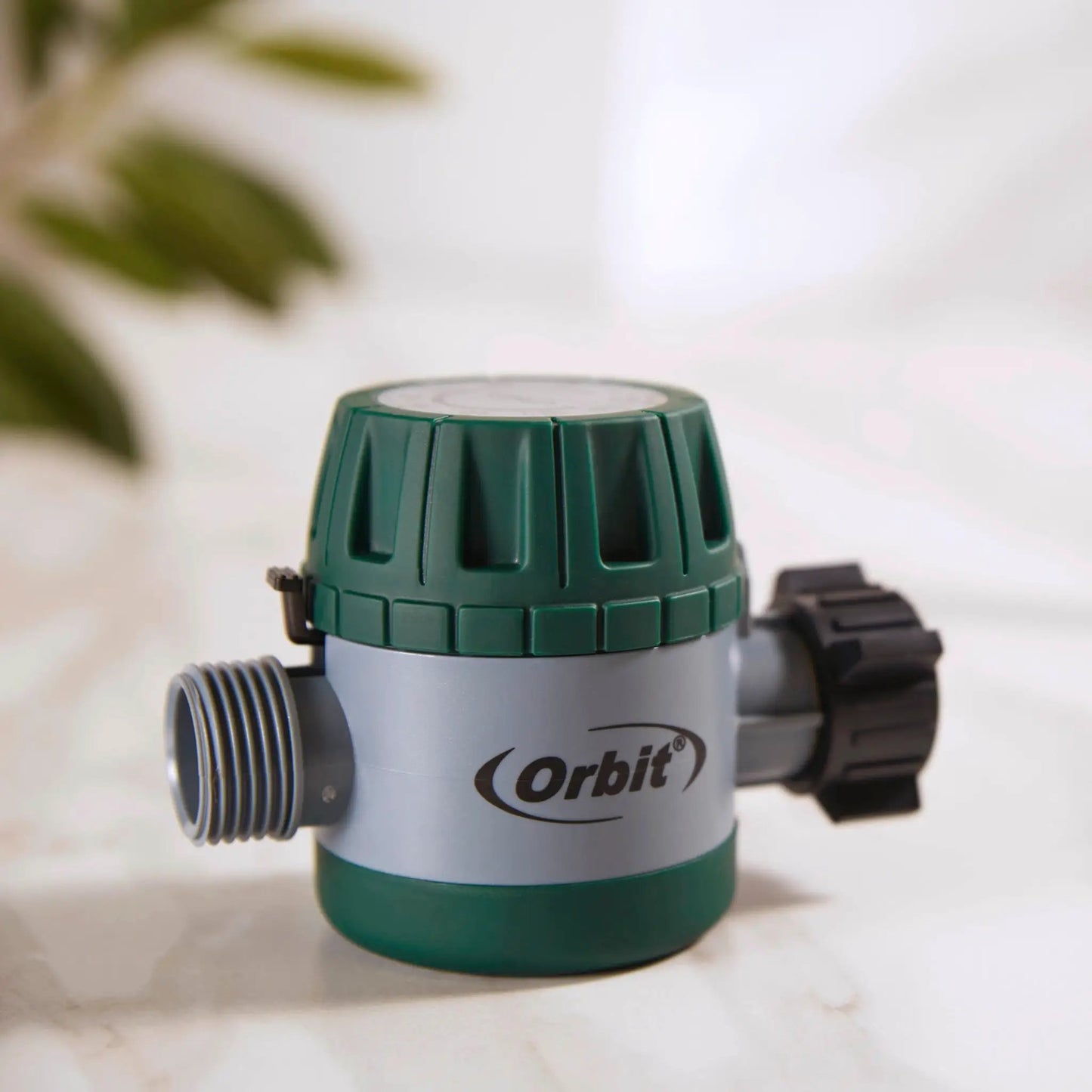 Orbit mechanical hose timer with green twist knob and grey body for garden watering on Tampa Home & Garden Store