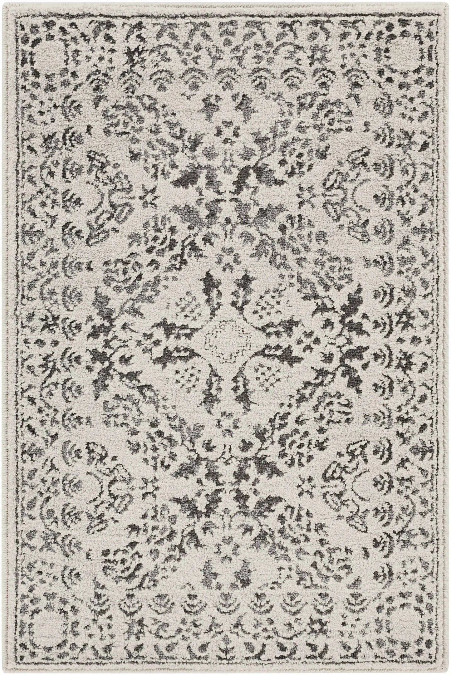 Megargel Charcoal Area Rug by Boutique Rugs with distressed gray floral motif on Tampa Home & Garden Store
