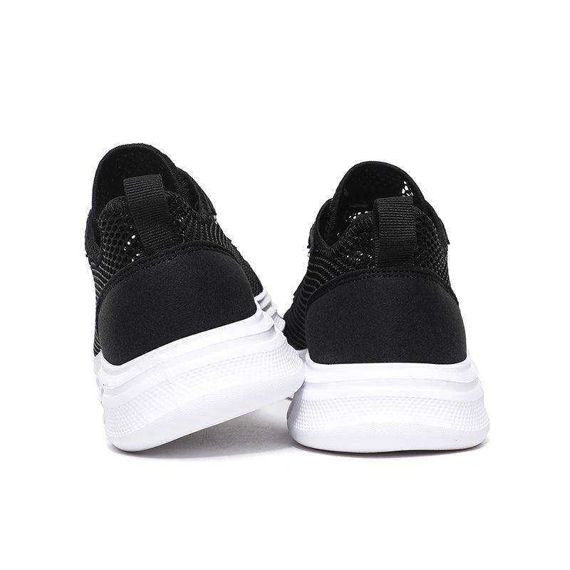 Stevvex men's black breathable mesh sneakers pair with white soles rear view on Tampa Home & Garden Store