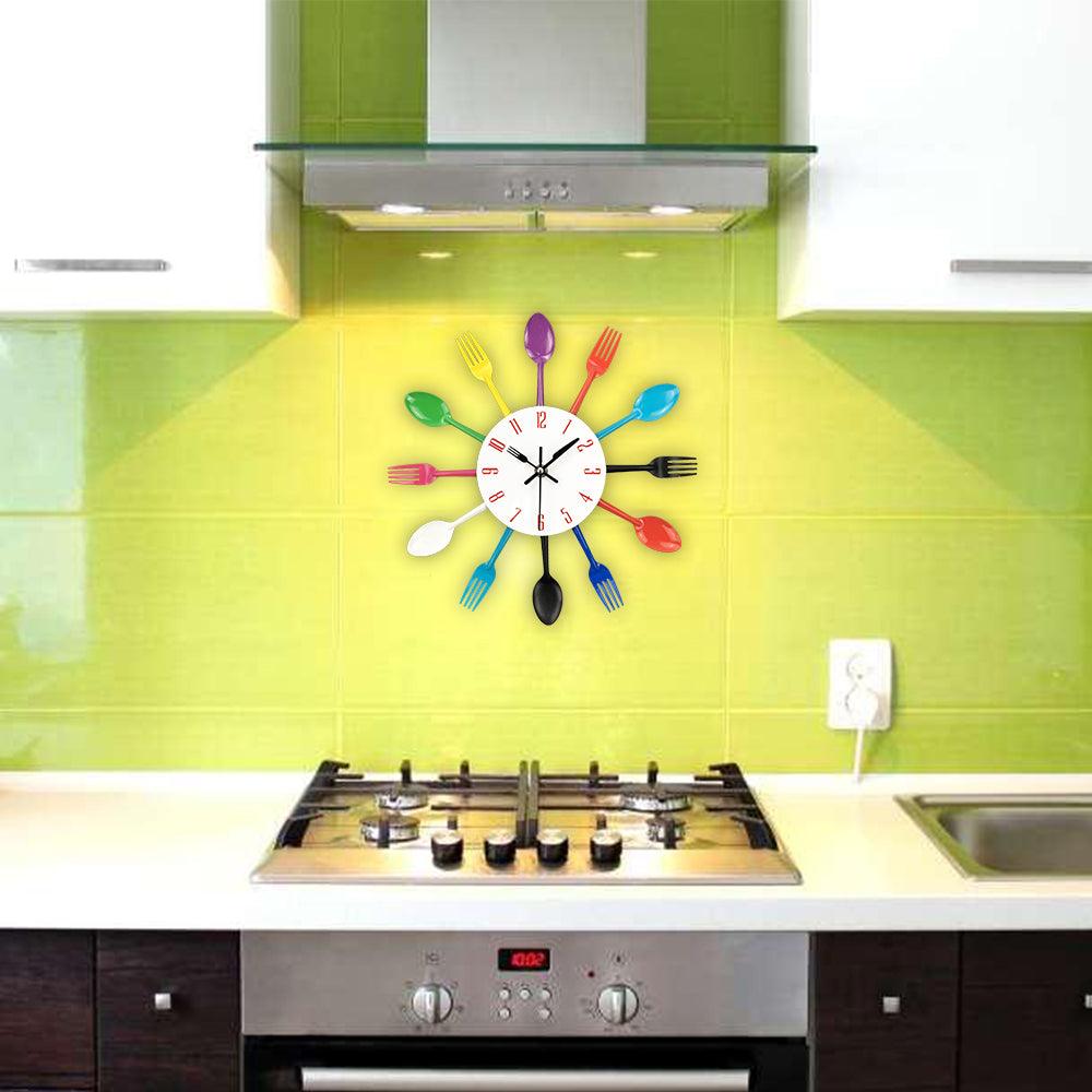 Metal kitchen wall clock by Stevvex with spoon and fork hands, cutlery design on Tampa Home & Garden Store