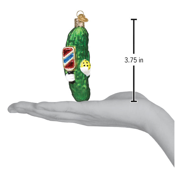 Glass pickleball ornament featuring a green pickle and striped paddle, 3.75 in tall on Tampa Home & Garden Store