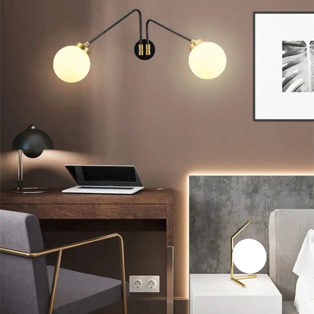 Black brass opal glass wall sconce with two globe lamps by Decorbites on Tampa Home & Garden Store