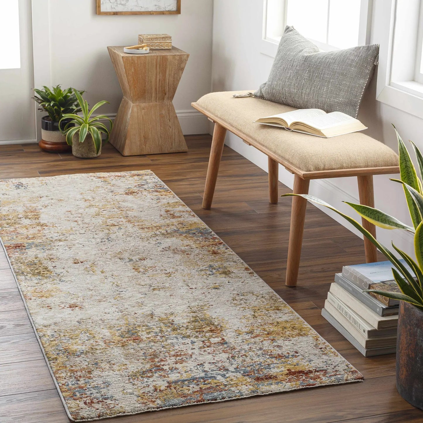 Middelburg Rock Pattern Luxe Area Rug by Boutique Rugs in beige with blue and rust accents on Tampa Home & Garden Store