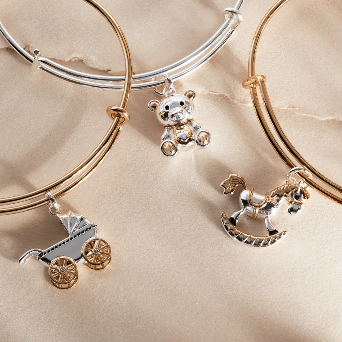 Alex and Ani Baby Carriage Bangle bracelet with silver and rose-tone bangles and a carriage charm on Tampa Home & Garden Store