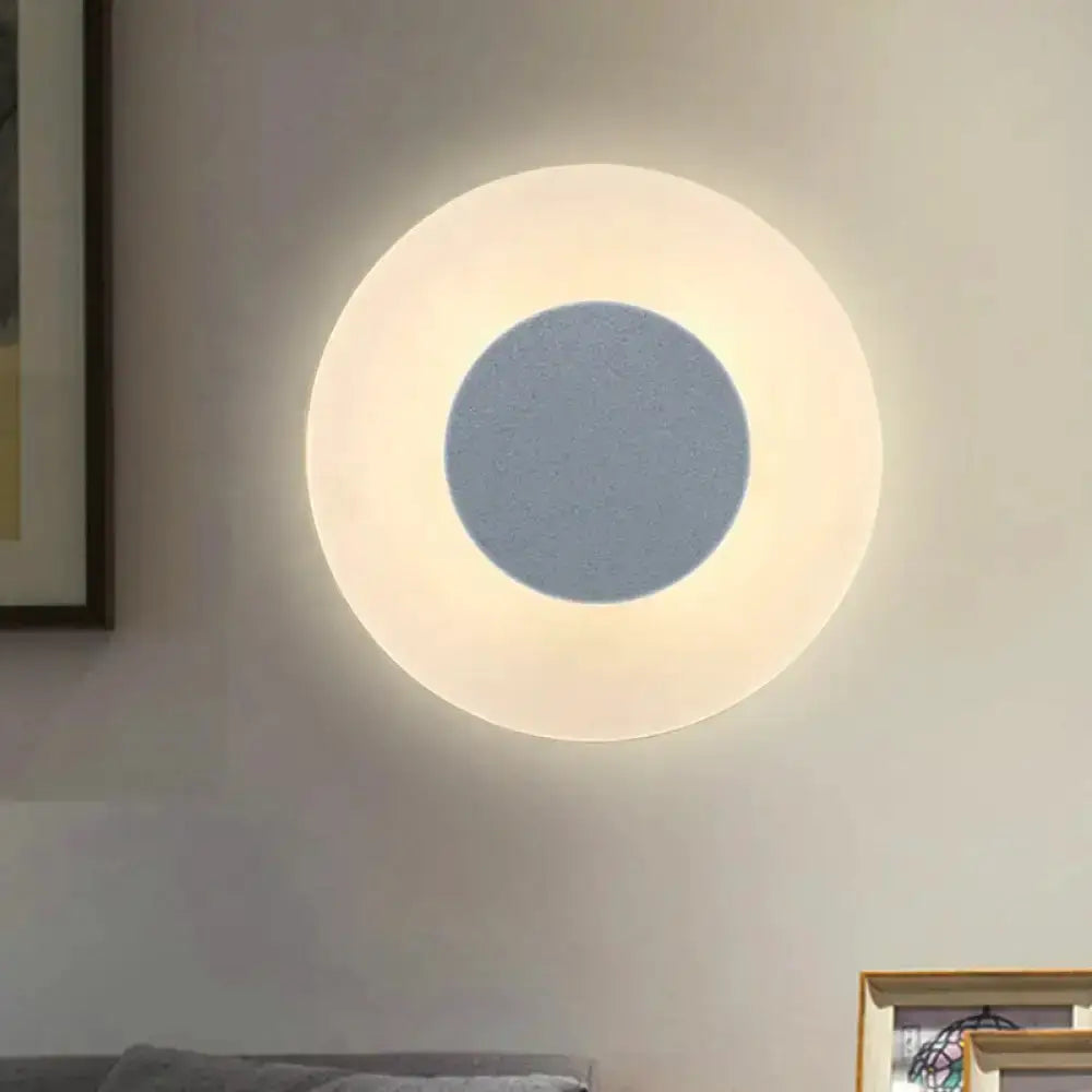 Ultra-thin acrylic LED wall sconce with circular ring design emits warm white glow on Tampa Home & Garden Store