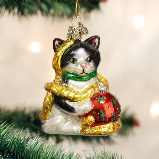 Holiday Kitten Glass Ornament with black and white kitten, green scarf, holding a red gift on Tampa Home & Garden Store