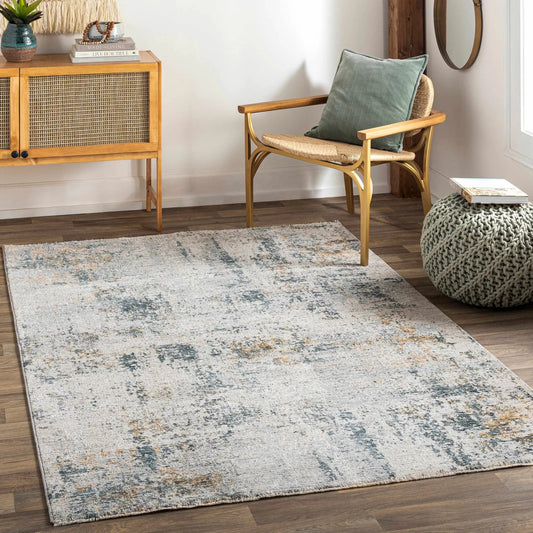 Montreat Luxe Rug in Cream and Teal by Boutique Rugs in a cozy living room with wicker chair on Tampa Home & Garden Store