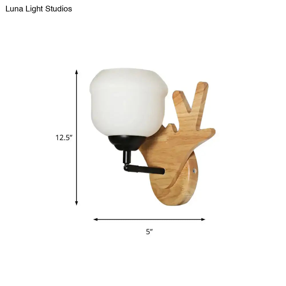 Wood deer head wall sconce by Decorbites with natural wood mount and white glass shade on Tampa Home & Garden Store