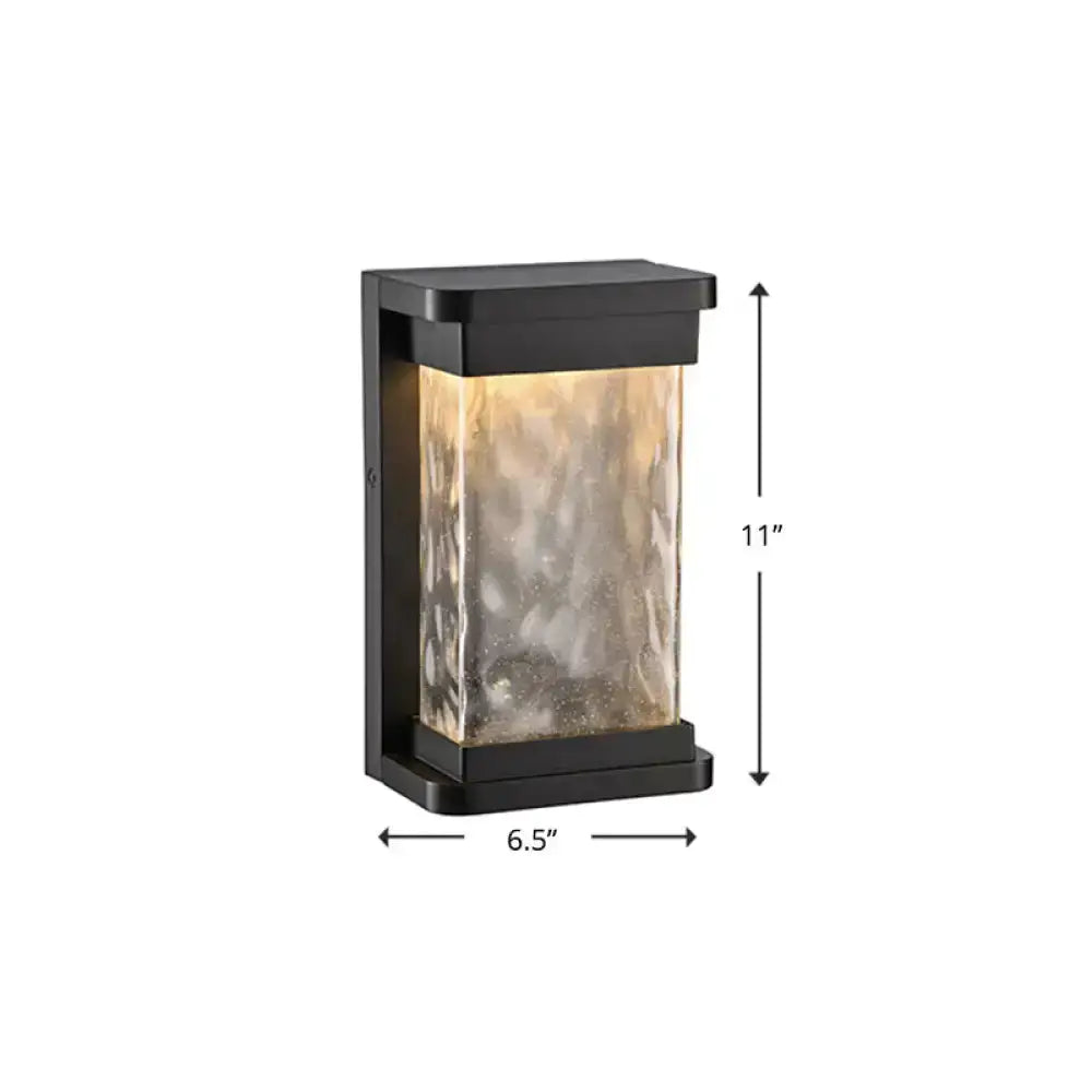 Modern black LED outdoor wall sconce with rippled glass cylinder Decorbites on Tampa Home & Garden Store