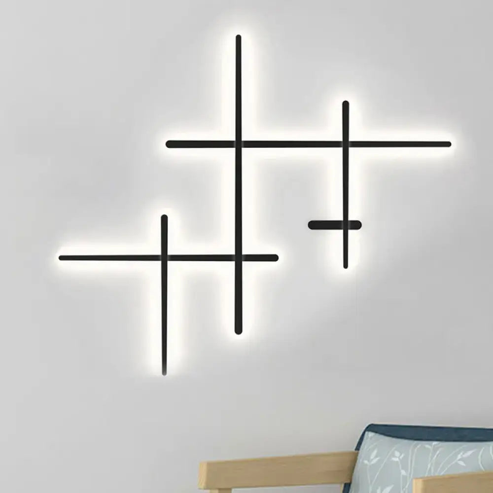 Black Crossed Lines Wall Light by Decorbites, geometric black metal LED wall sconce with glow on Tampa Home & Garden Store