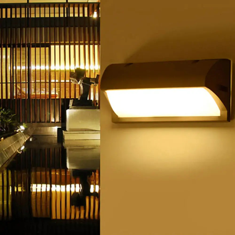 Black rectangle outdoor wall light by Decorbites, black metal sconce with warm glow on Tampa Home & Garden Store