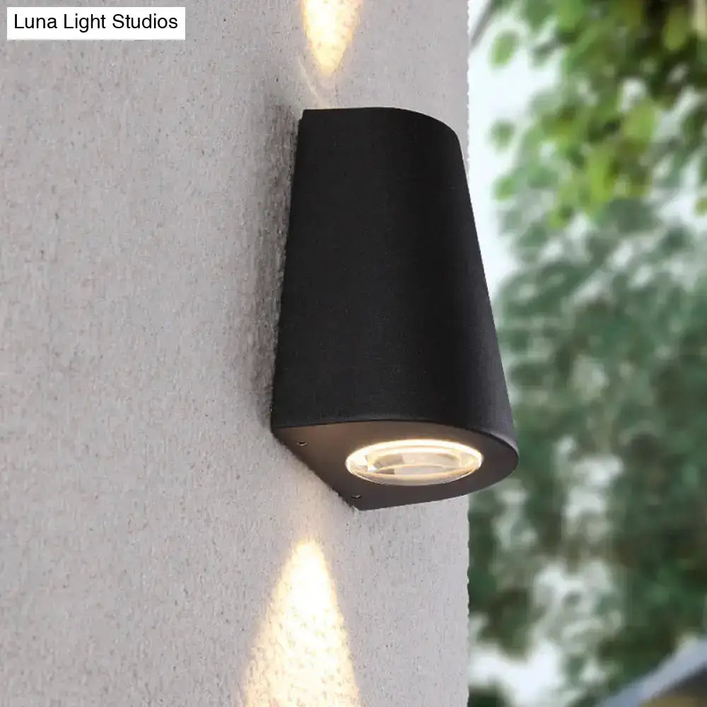 Decorbites modern black trapezoid outdoor wall light with round LED lens for garden on Tampa Home & Garden Store
