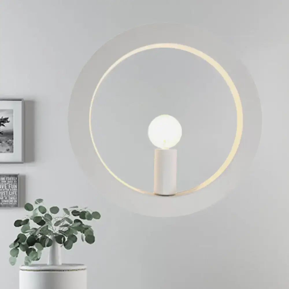 Black circle metal industrial wall sconce with white cylindrical base and glowing halo ring by Decorbites on Tampa Home & Garden Store