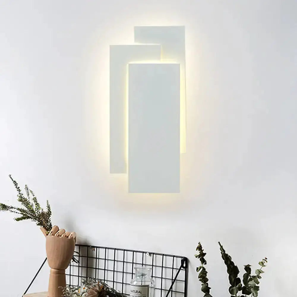 Modern white LED wall lamp with rectangular panels, warm backlit glow, 5in height for bedroom on Tampa Home & Garden Store