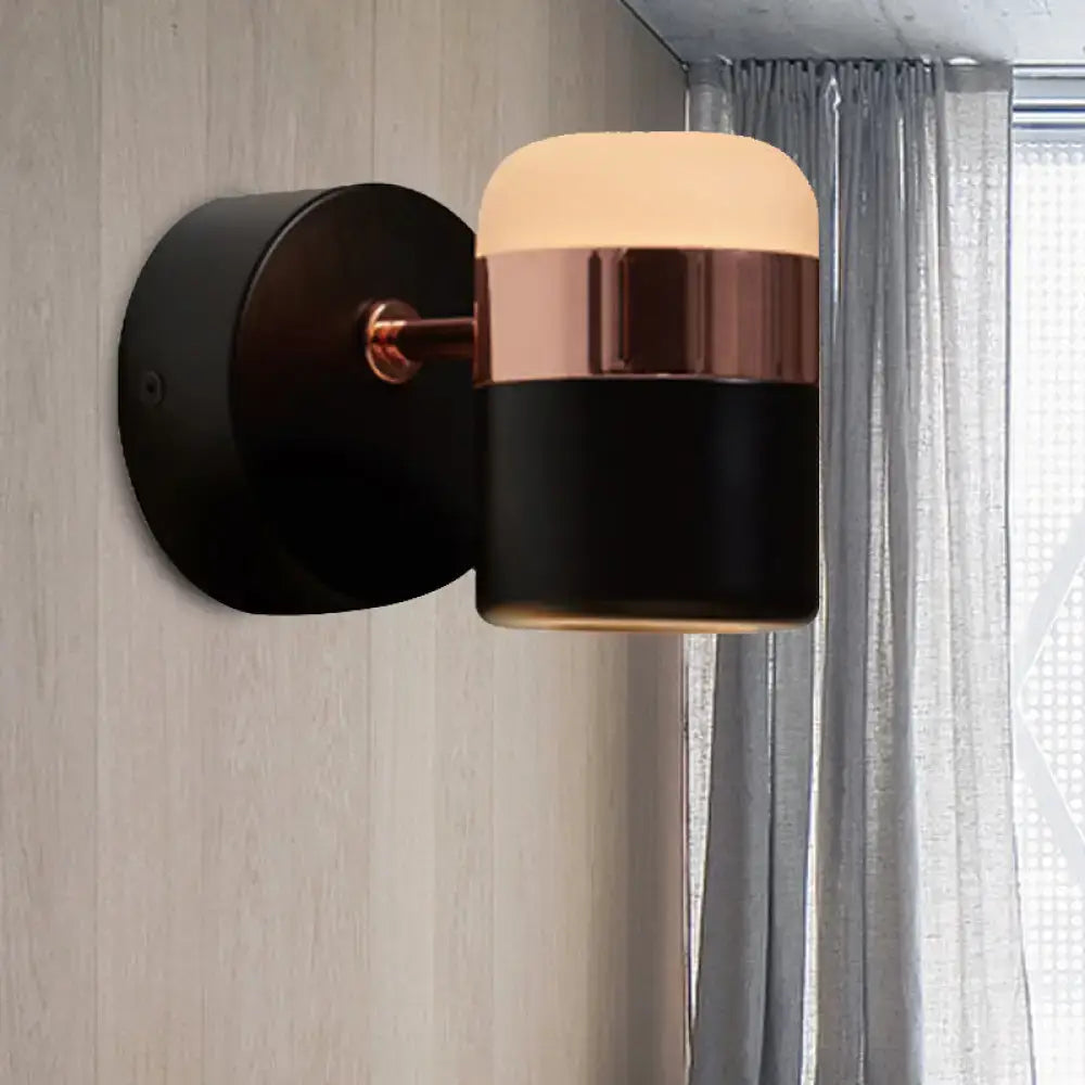 Black glass rotatable LED wall sconce with copper band and backplate on Tampa Home & Garden Store