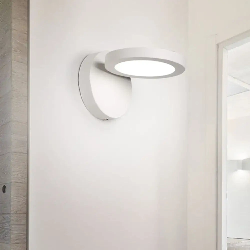 Decorbites white acrylic rotating wall light with circular LED head mounted on white wall on Tampa Home & Garden Store