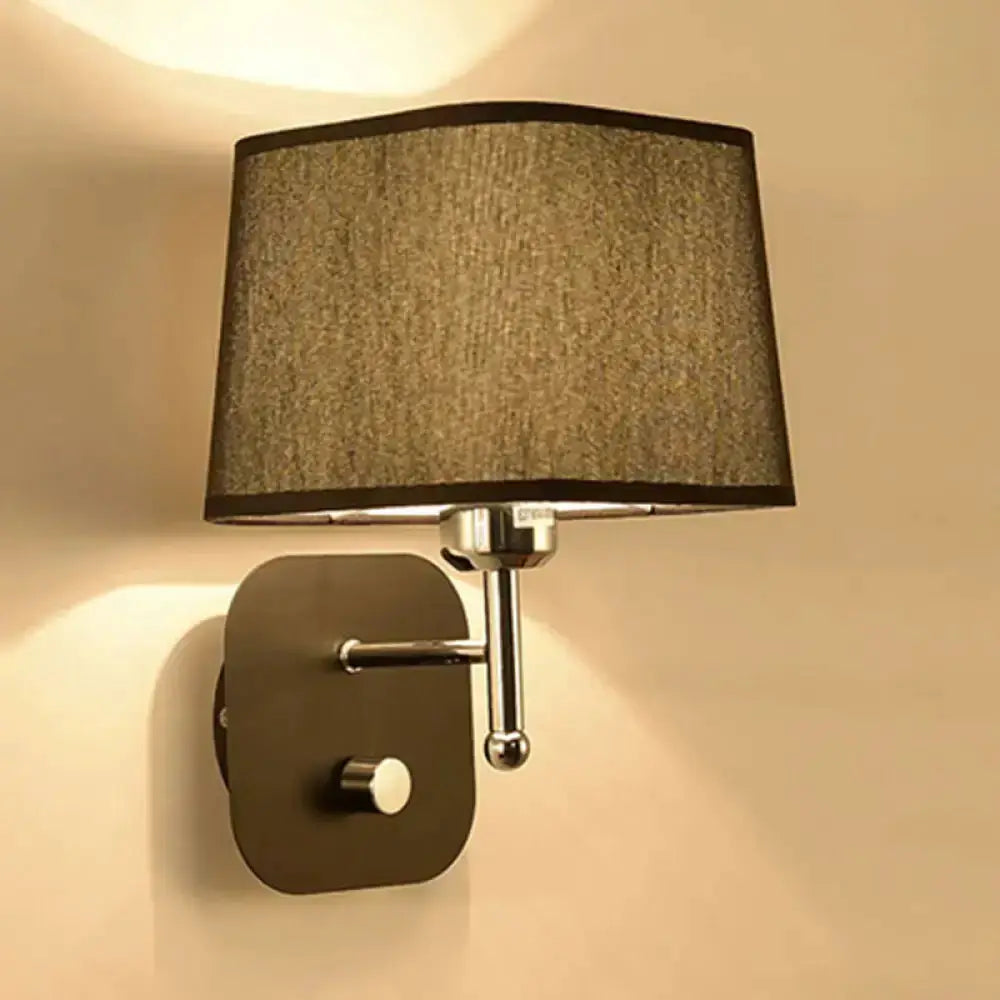Modern brass and beige linen wall sconce with dark backplate and chrome arm bedroom lamp on Tampa Home & Garden Store