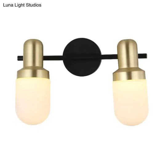 Modern brass and black glass two-light sconce wall lamp by Decorbites for bedroom on Tampa Home & Garden Store