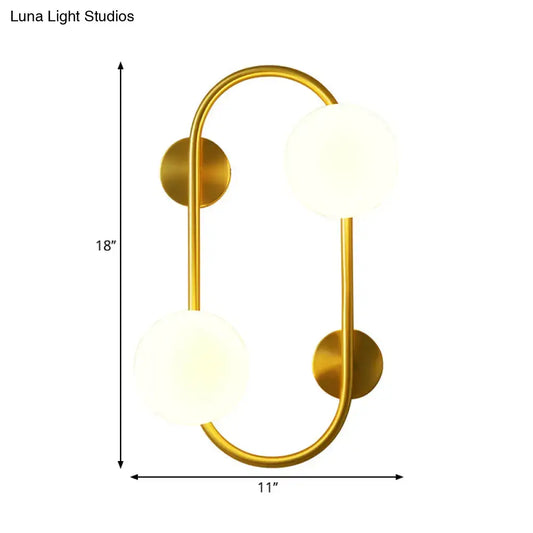 Milk Glass LED Sconce by Decorbites; brass arc frame with 2 frosted globes, 18in tall x 11in wide on Tampa Home & Garden Store