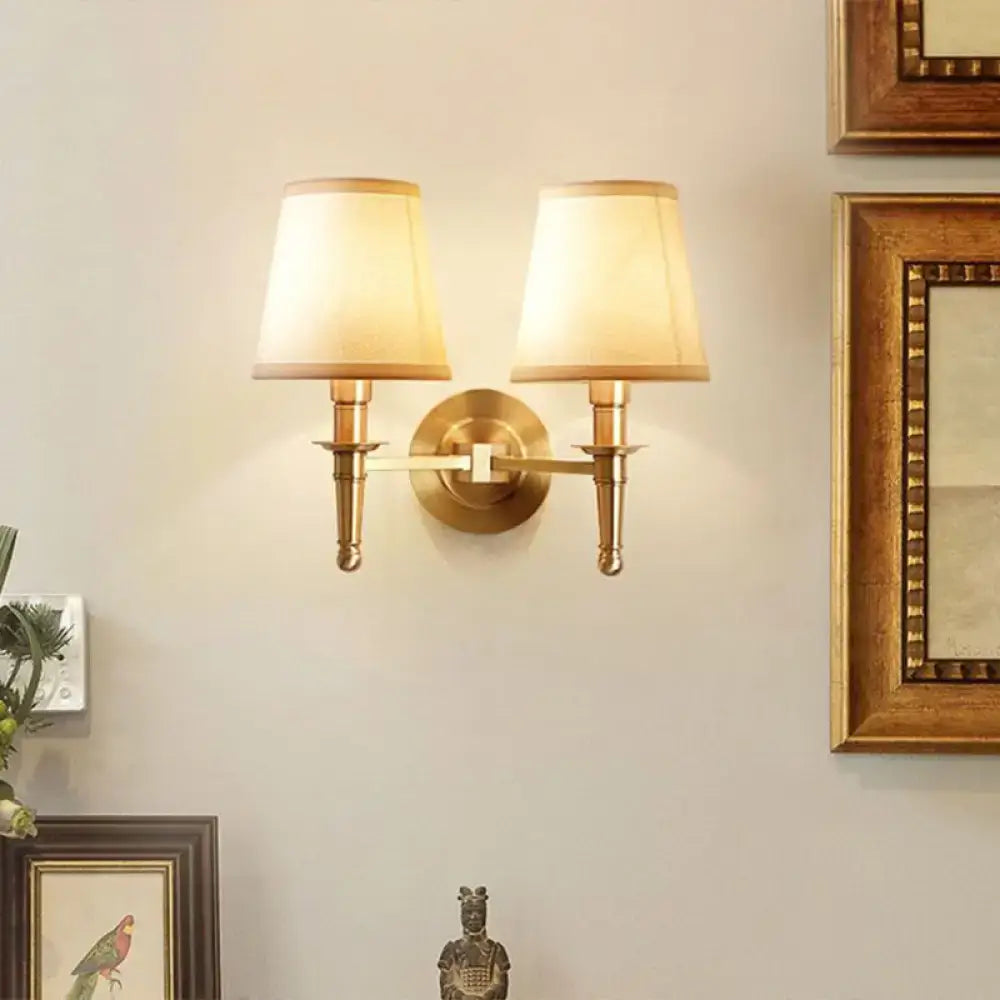 Brass fabric wall sconce with dual arms and beige fabric shades, Decorbites on Tampa Home & Garden Store