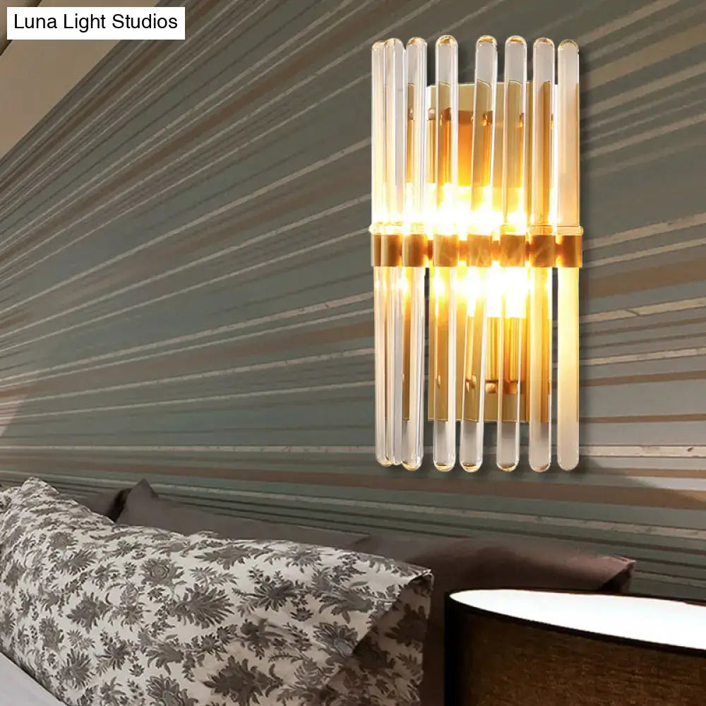 Brass crystal wall sconce lamp with vertical clear glass rods and warm glow by Decorbites on Tampa Home & Garden Store