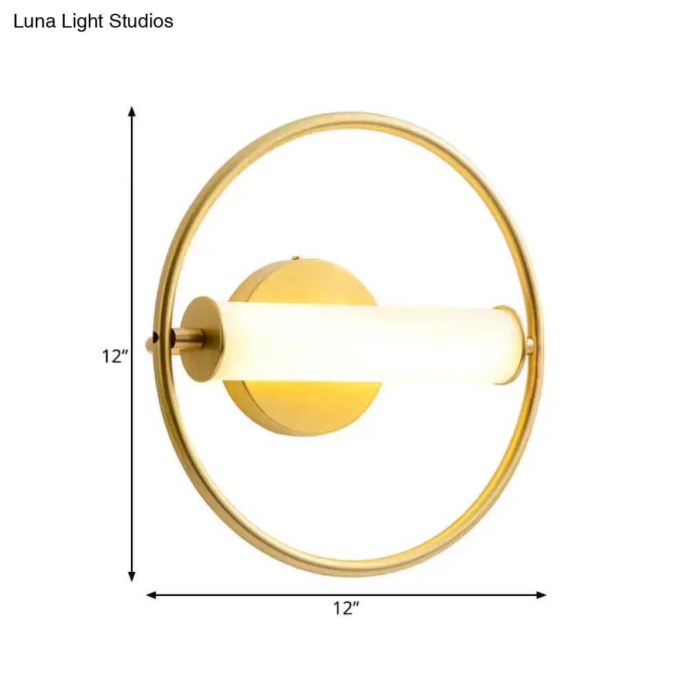 Brass opal glass industrial sconce with a gold ring and frosted glass tube by Decorbites on Tampa Home & Garden Store