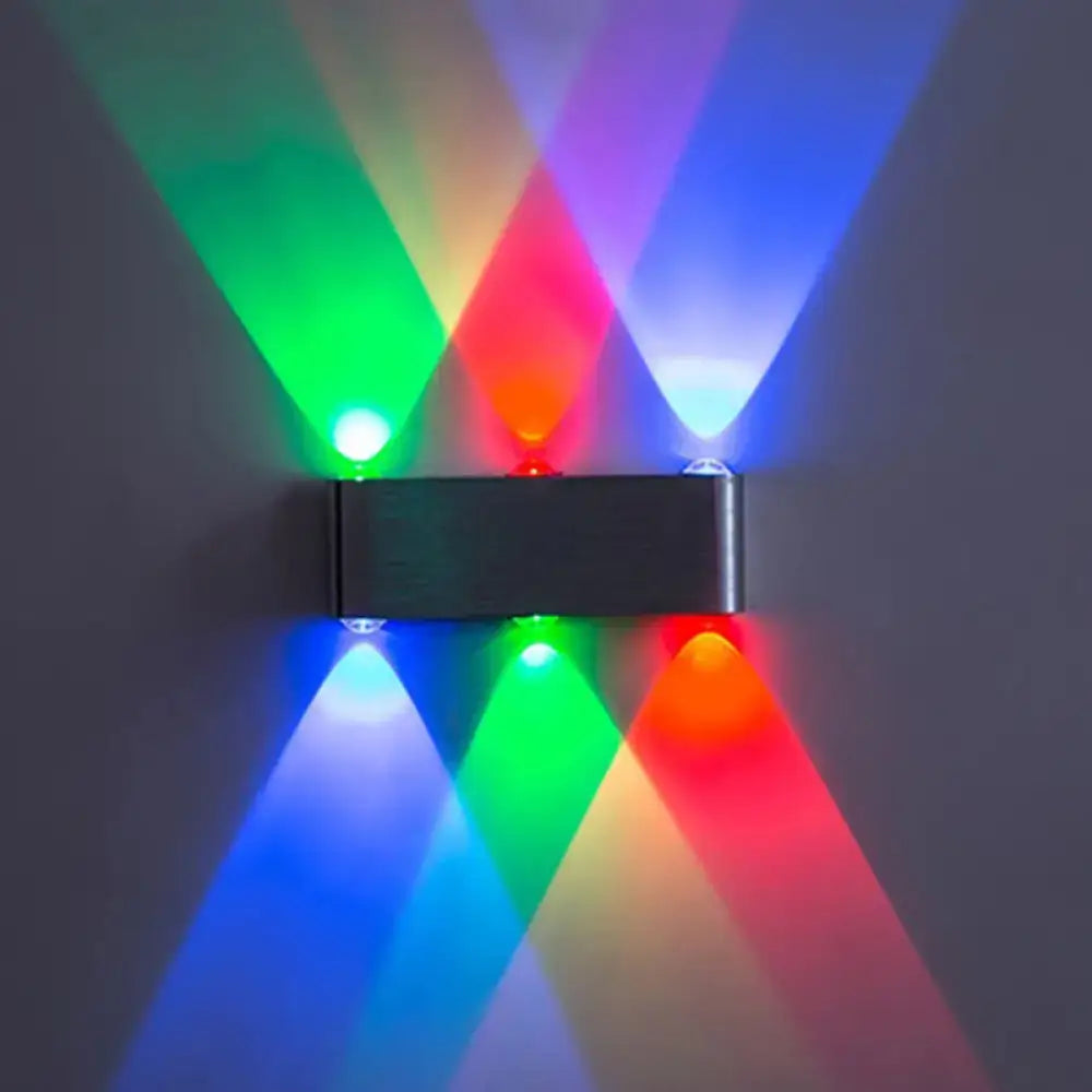Nickel rectangular wall lamp by Decorbites projecting vivid multicolor LEDs on wall on Tampa Home & Garden Store