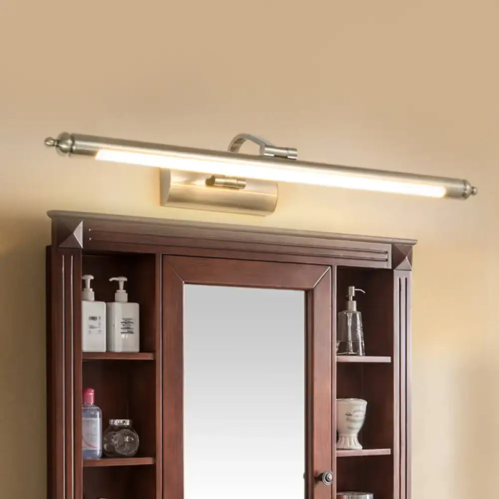 Nickel warm wall sconce, long tubular bar light above a dark wood cabinet with central mirror on Tampa Home & Garden Store