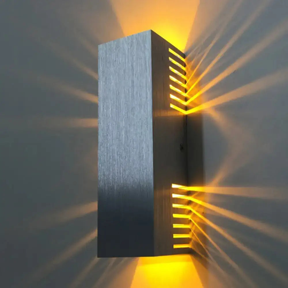Decorbites silver brushed wall light sconce with slotted design and warm amber glow on Tampa Home & Garden Store