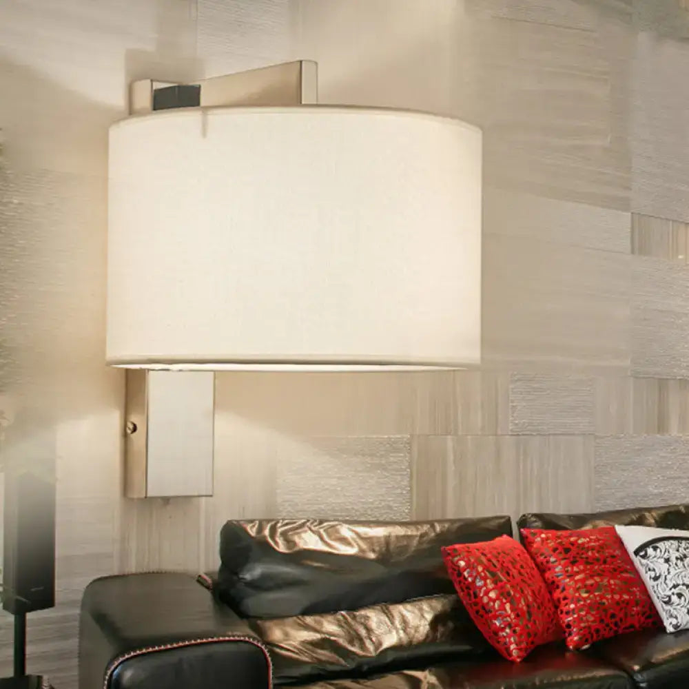 Decorbites Charcoal Drum Fabric Sconce wall-mounted fixture with white shade in living room on Tampa Home & Garden Store