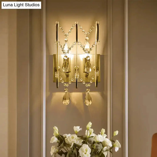 Decorbites chrome crystal wall sconce with teardrop prisms and bead chains on backplate on Tampa Home & Garden Store
