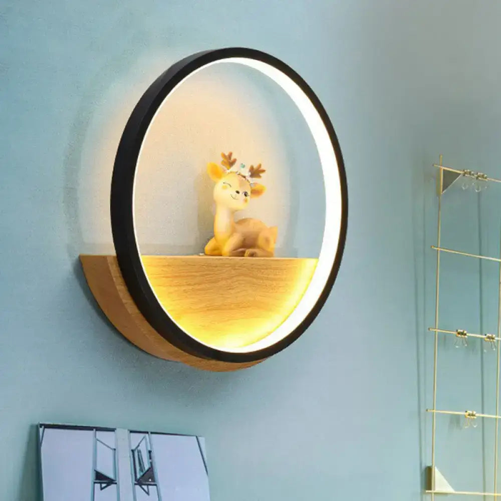 Black Deer Wall Light by Decorbites, circular black ring with warm wood shelf glow on Tampa Home & Garden Store